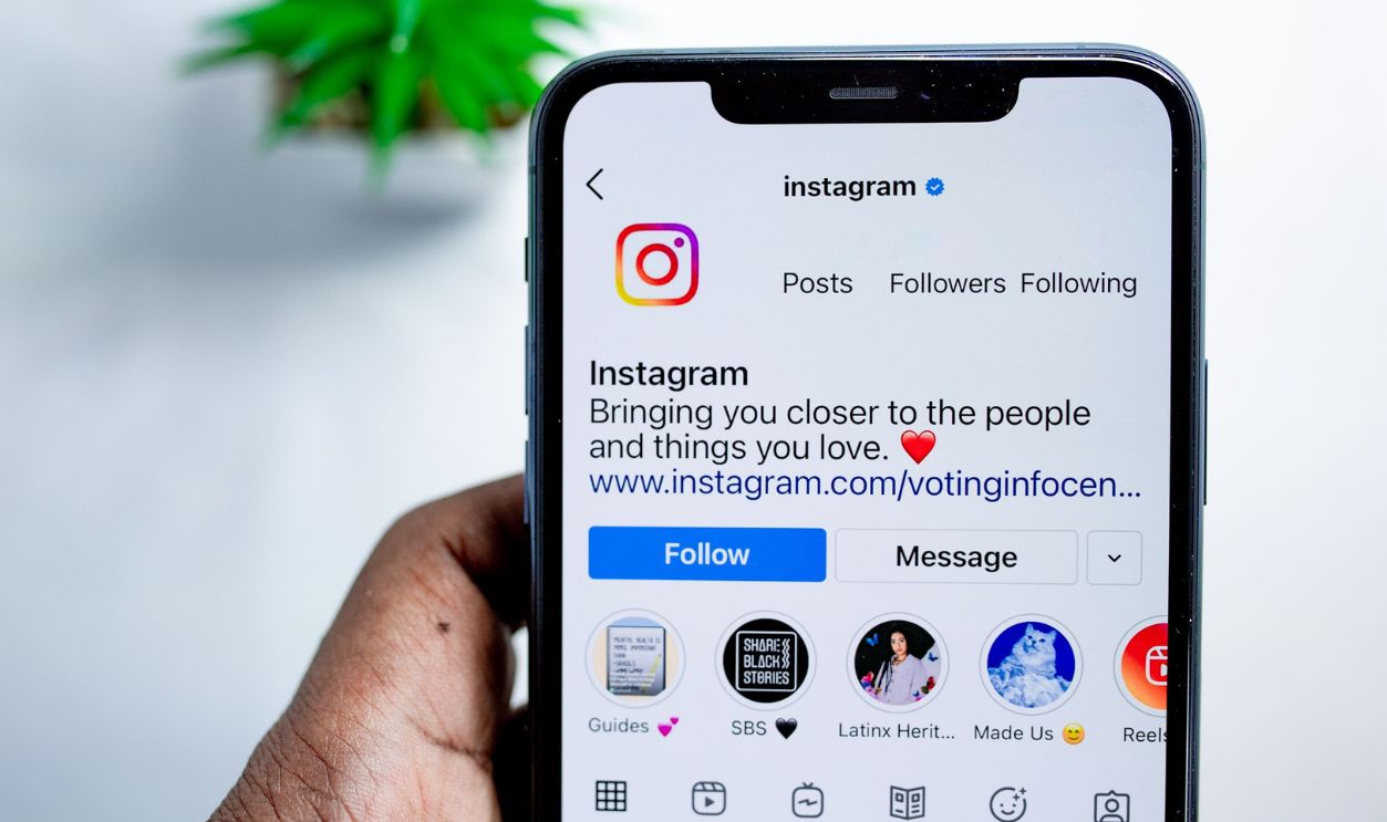 Close-up of a smartphone displaying the Instagram app, emphasizing social media connection