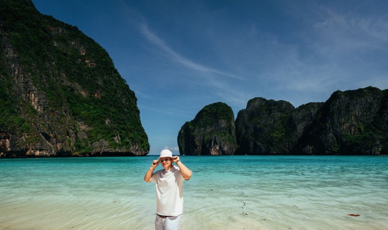 Tourist enjoying the stunning beach at Maya Bay, Krabi, Thailand