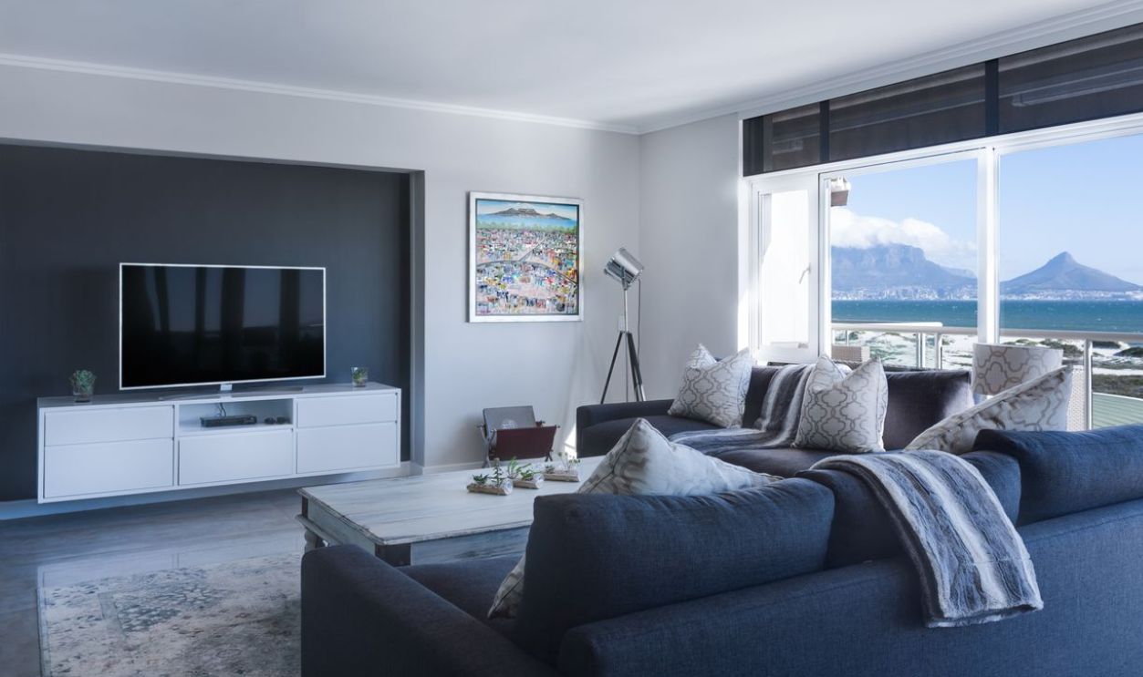 Stylish living room with a view of Table Mountain, blending modern design with natural beauty.