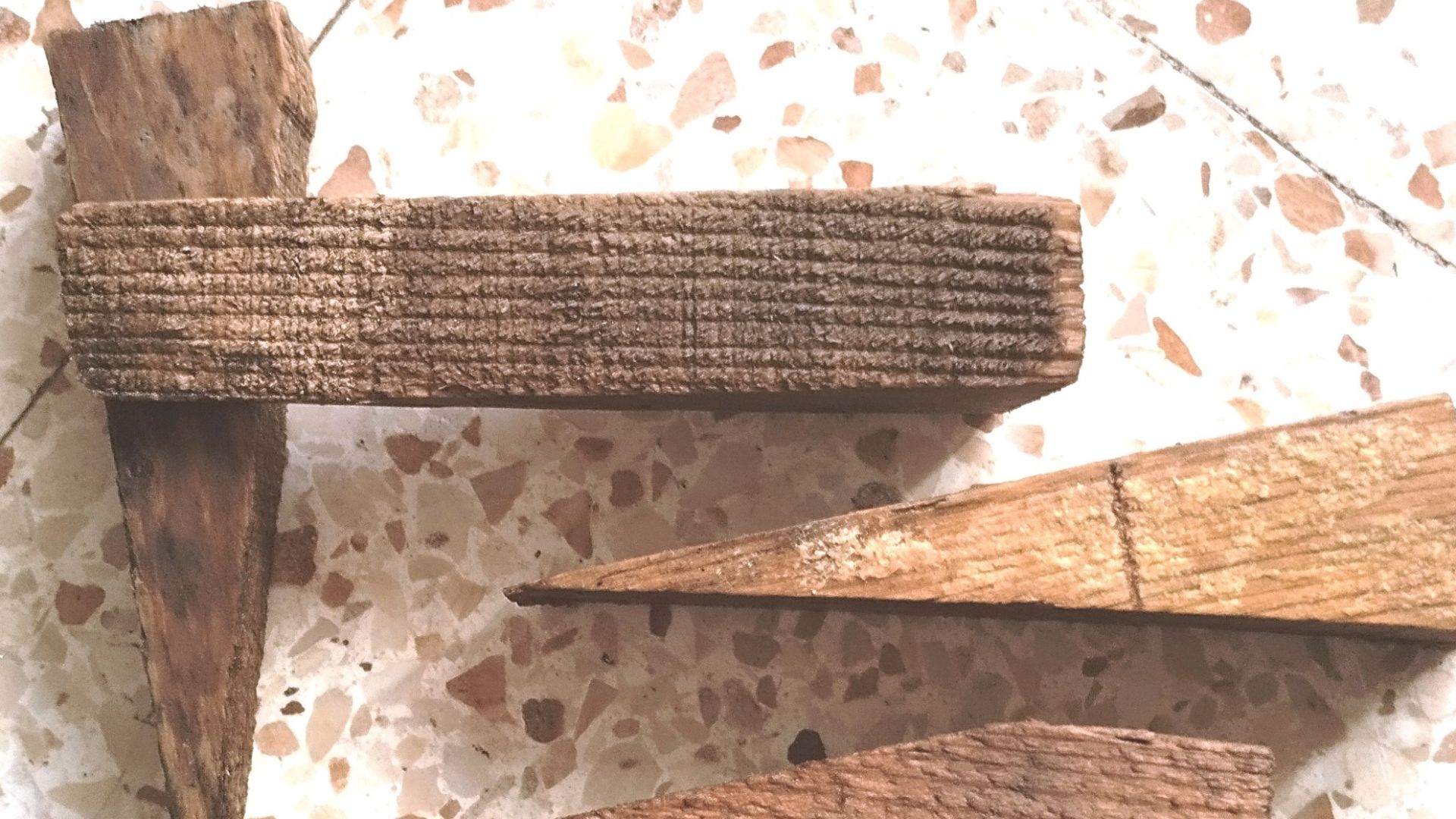 A piece of wood cut at a sharp angle for use by builders