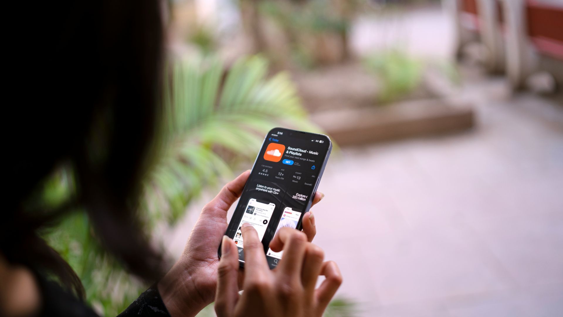 a woman holding a smart phone in her hand