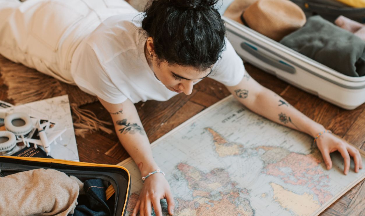 Woman planning travel and looking at map