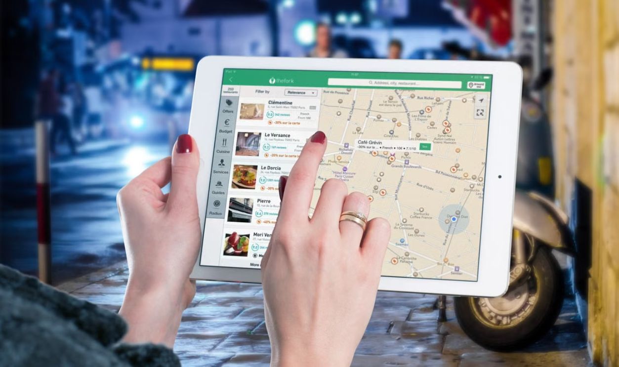 Hands using a digital map on a tablet 