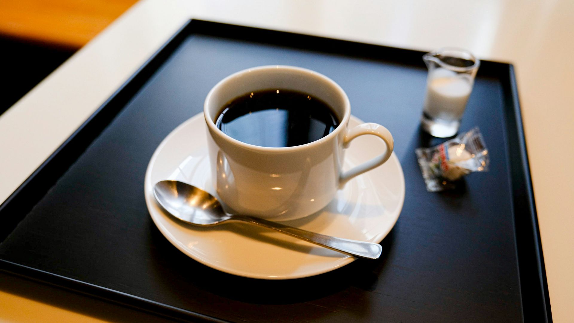 white ceramic cup on saucer