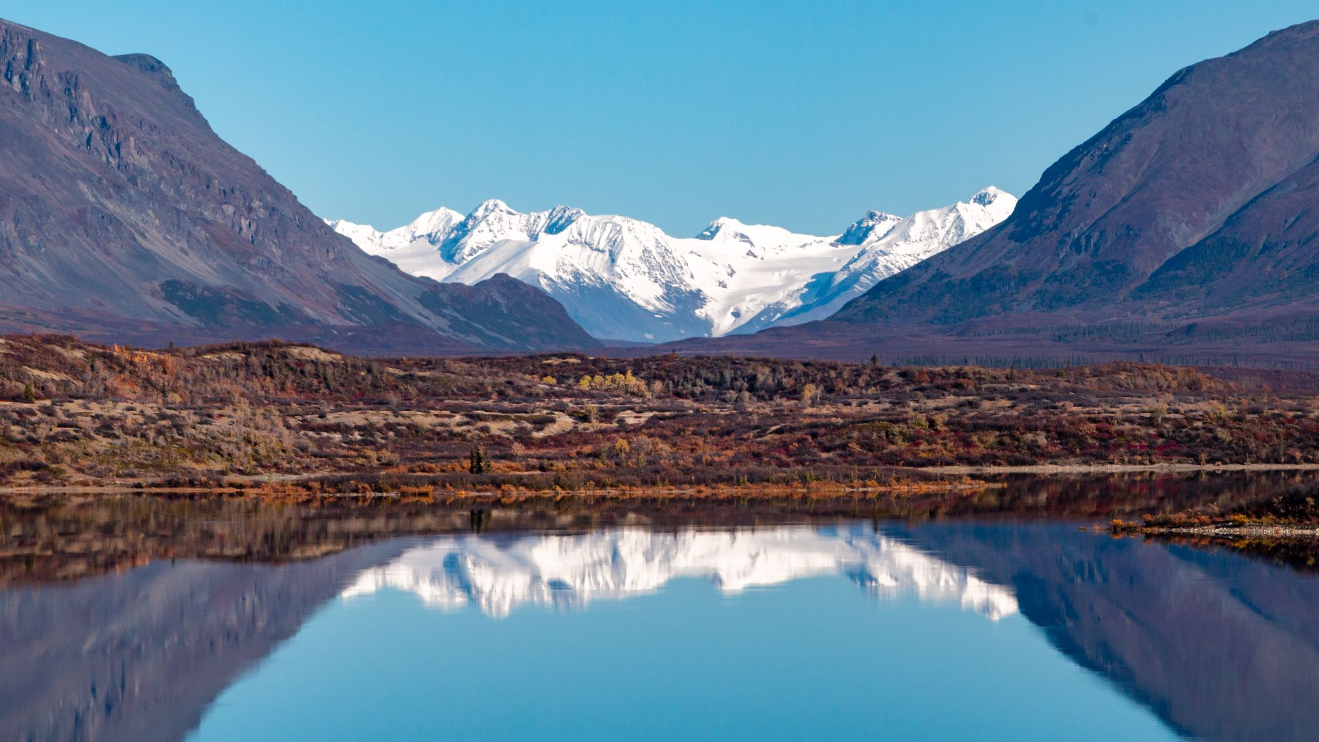 Alaska Range mountains by Landmark Gap are reflected in Upper Tangle Lake, near Alaska's Denali Highway. BLM Alaska photo by Craig McCaa.