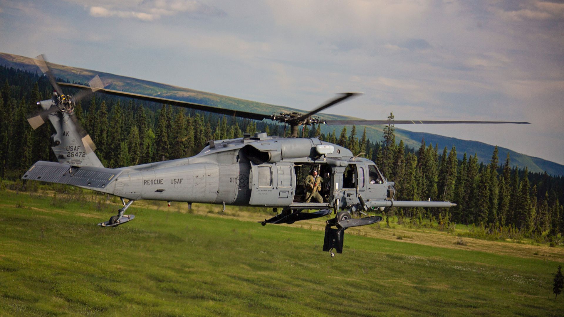 An Alaska Air National Guard HH-60 Pave Hawk, from the 210th Rescue Squadron, performs a simulated search and rescue pattern in Alaska. The 210th Rescue Squadron is part of a network of search-and-rescue organizations that save hundreds of lives in and ar