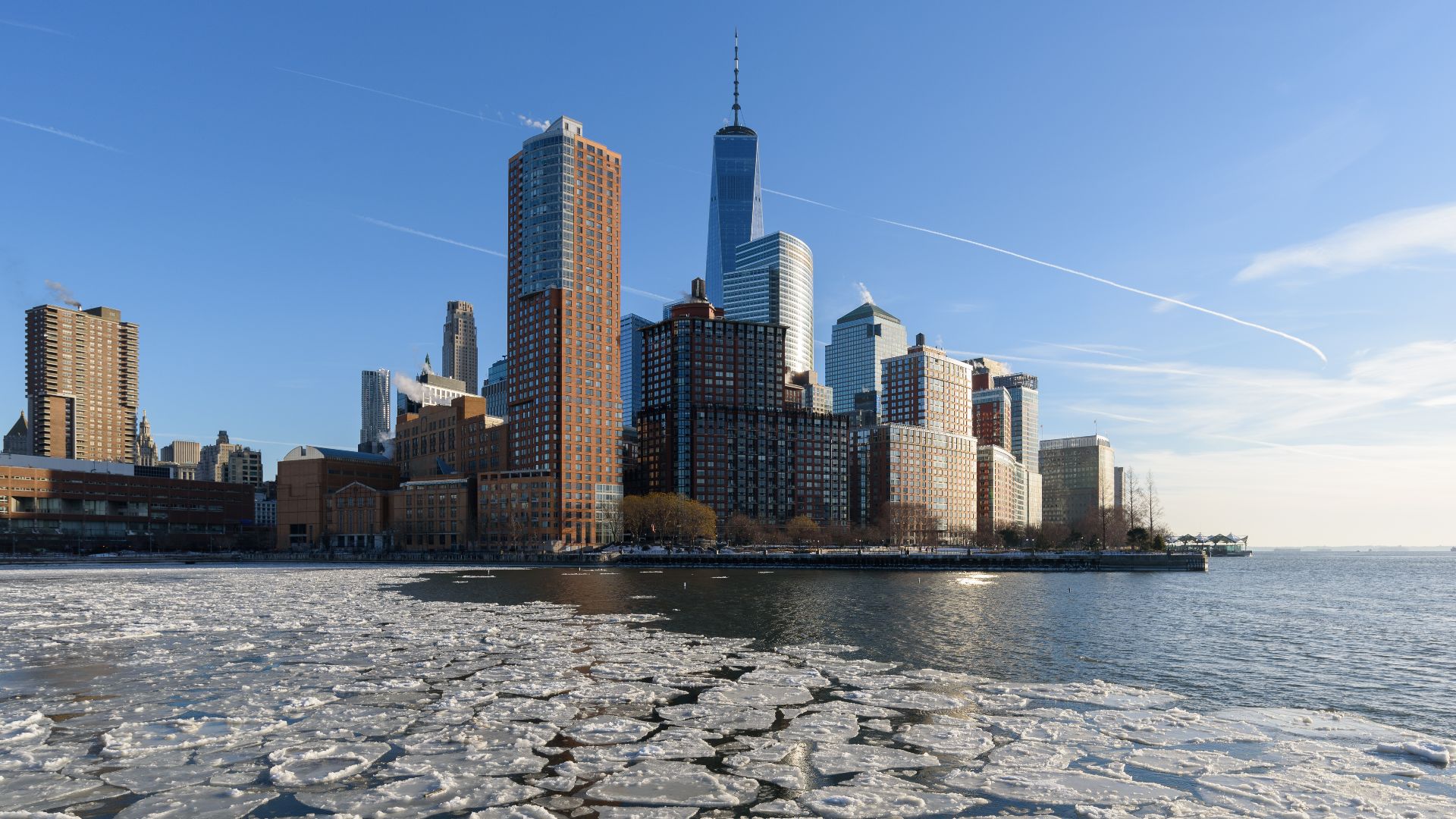 Battery Park City skyline over a frozen Hudson River, New York City.