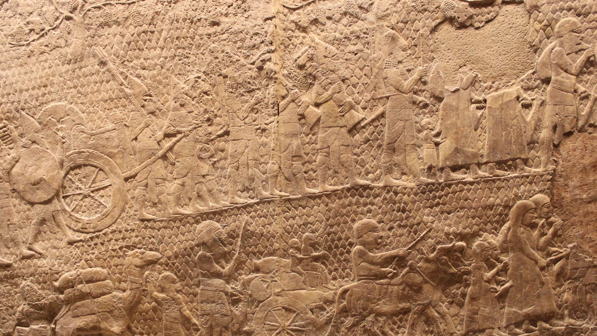 Bas-relief from the south-west palace of Nineveh, on the taking of Lachish.
After the capture of Lachish: Assyrian soldiers carry off booty from the city, and Judeans prisoners are taken into exile with their goods and animals.
Panels 8-9 in Room XXXVI