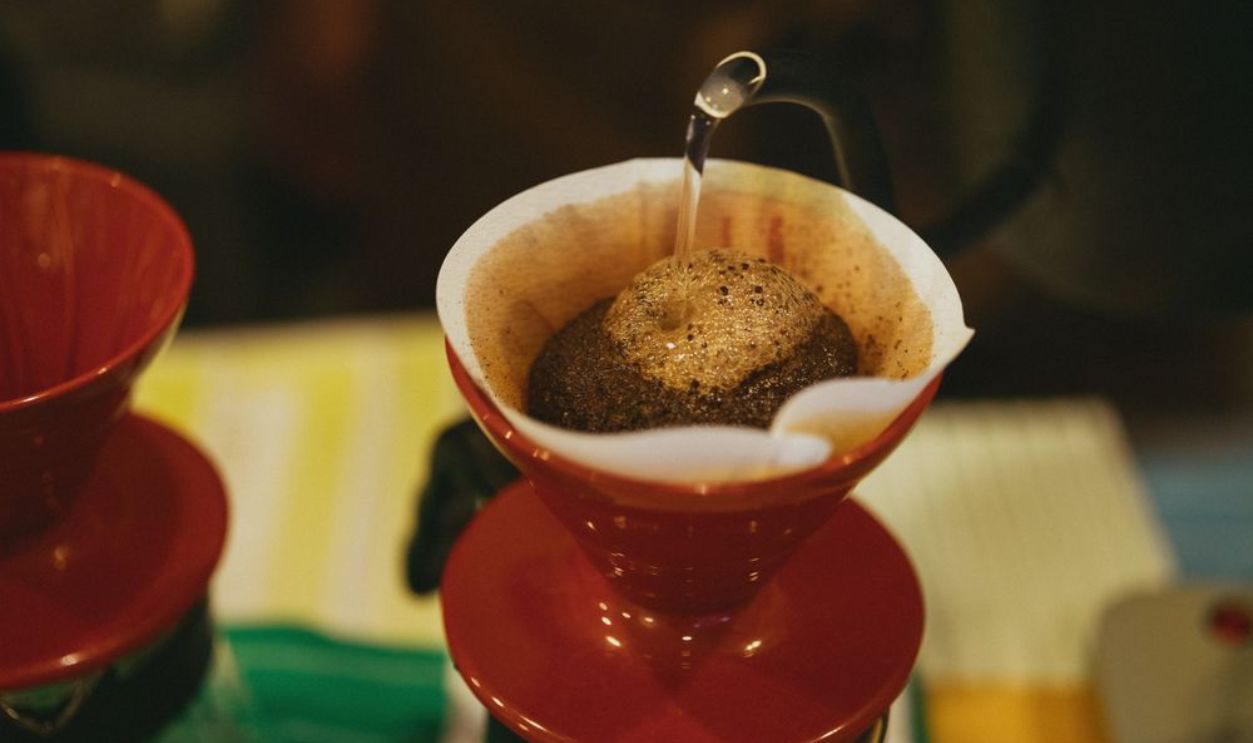 Close-up of hot water being poured over coffee grounds in a Tokyo cafe.