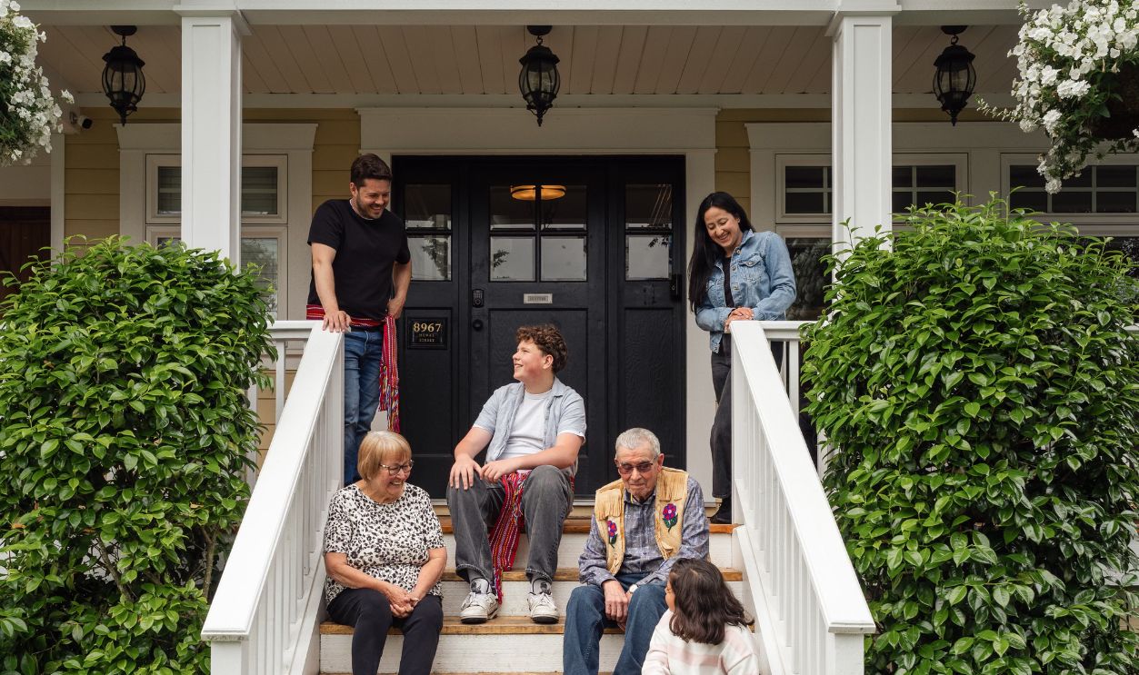 A diverse family enjoying quality time together on a porch, showcasing warmth and community