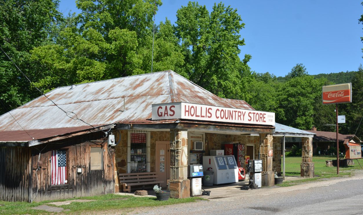 Charming vintage country store with gas pumps and Coca-Cola sign, tucked in rural greenery