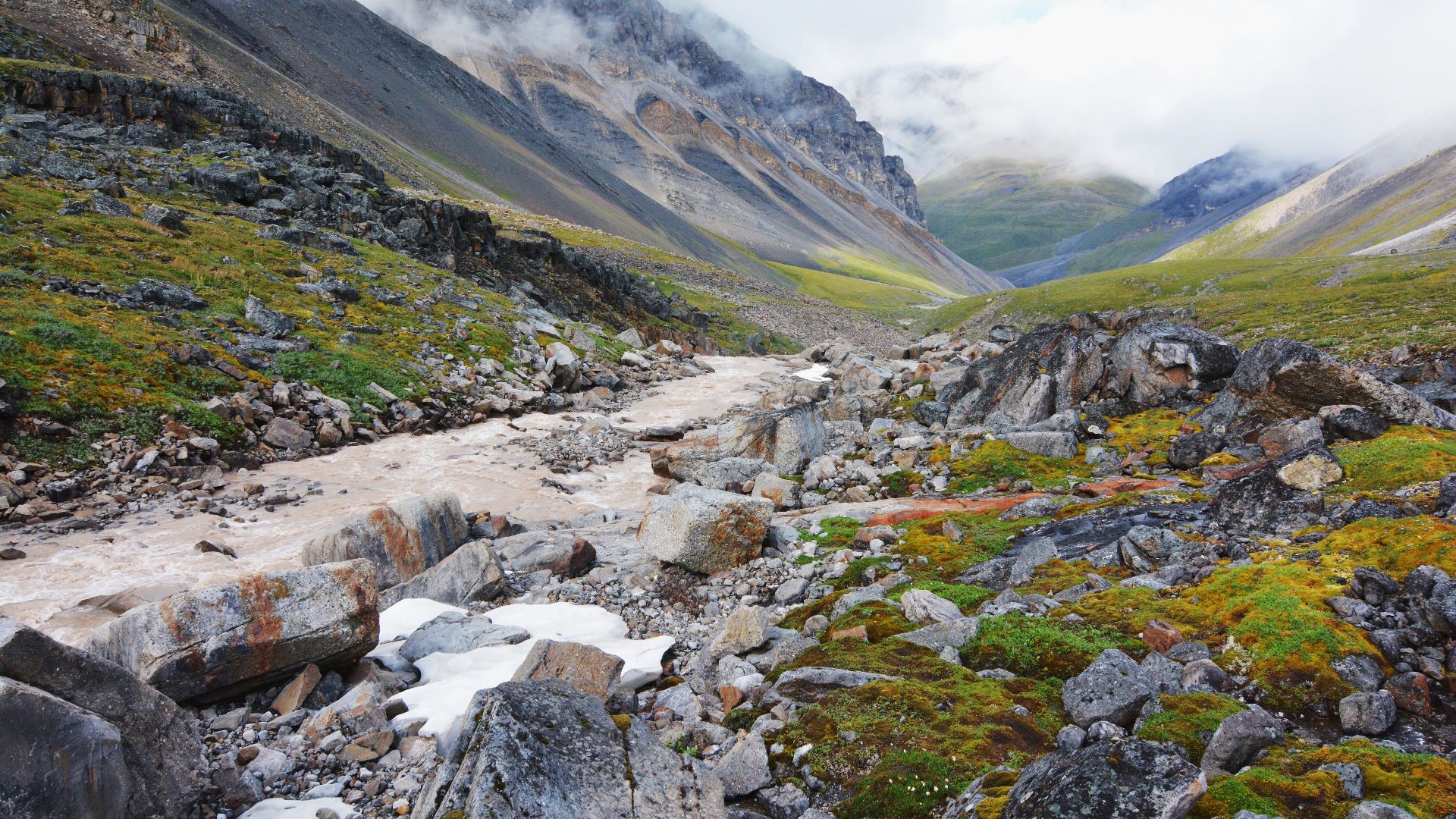A glacial stream flowing through a remote mountain valley in Gates of the Arctic National Park.