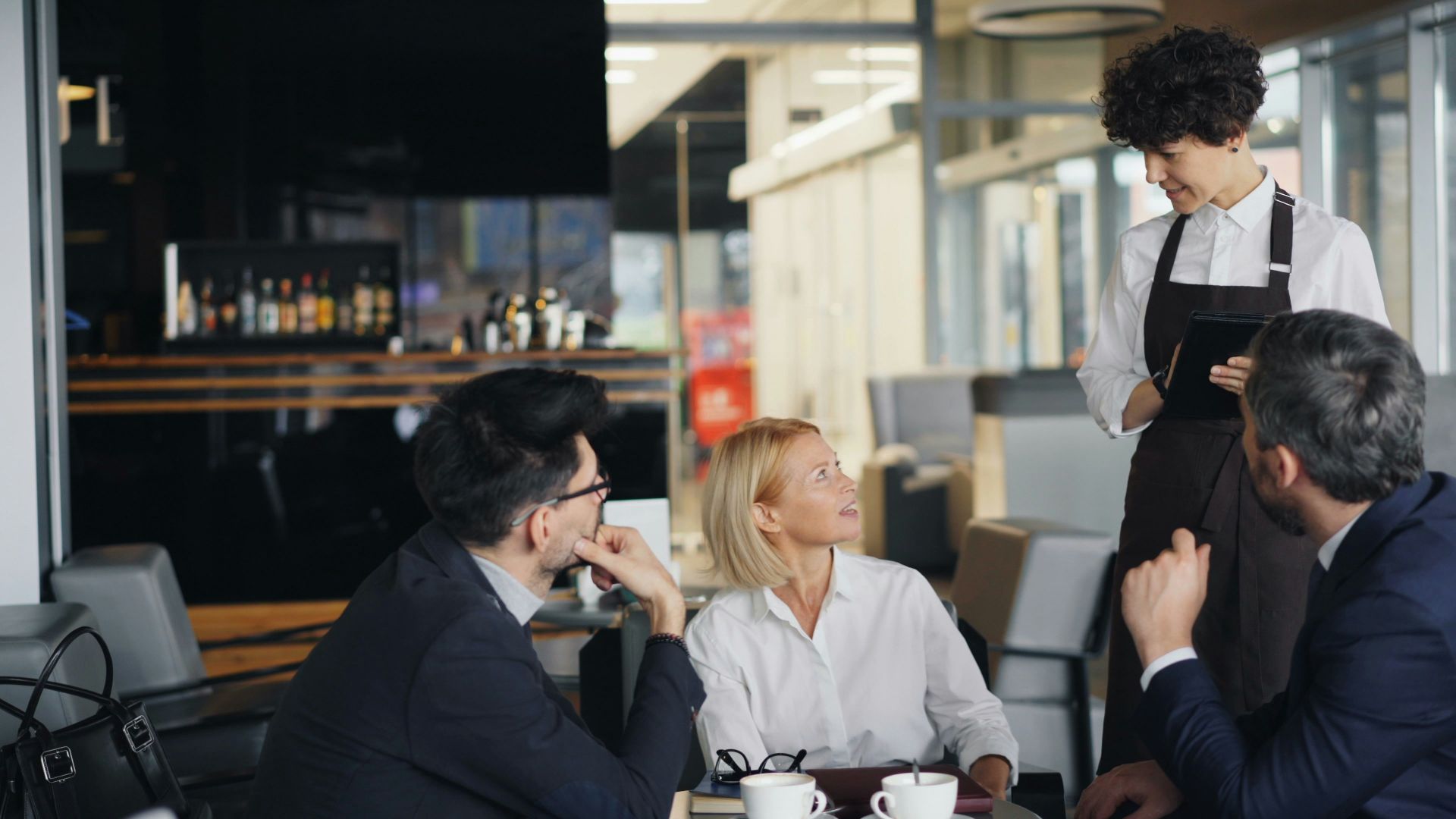 a group of people sitting around a table