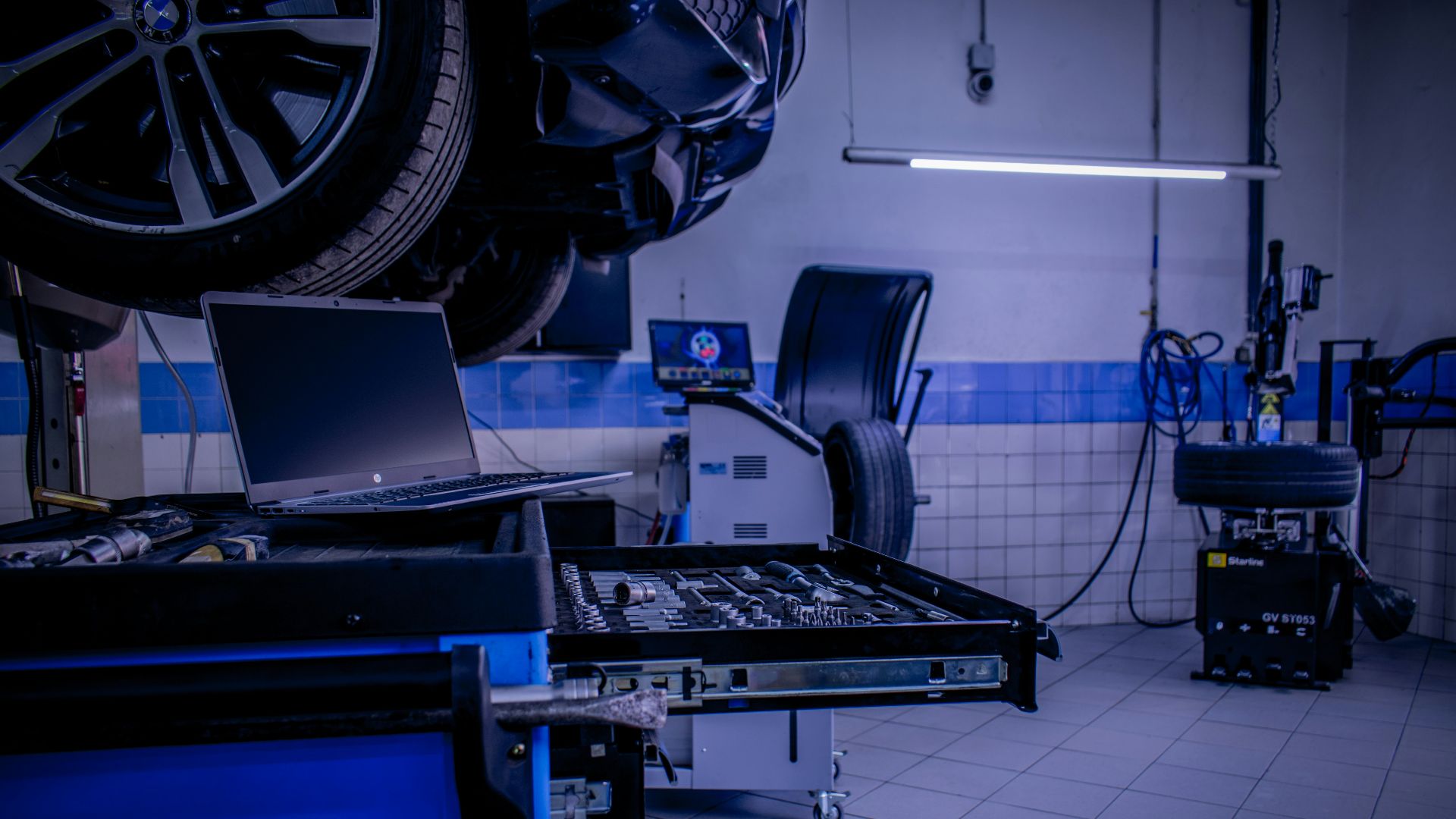 a room with a laptop and other equipment
