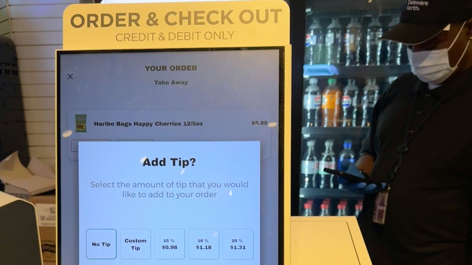 A checkout counter with a cell phone on it