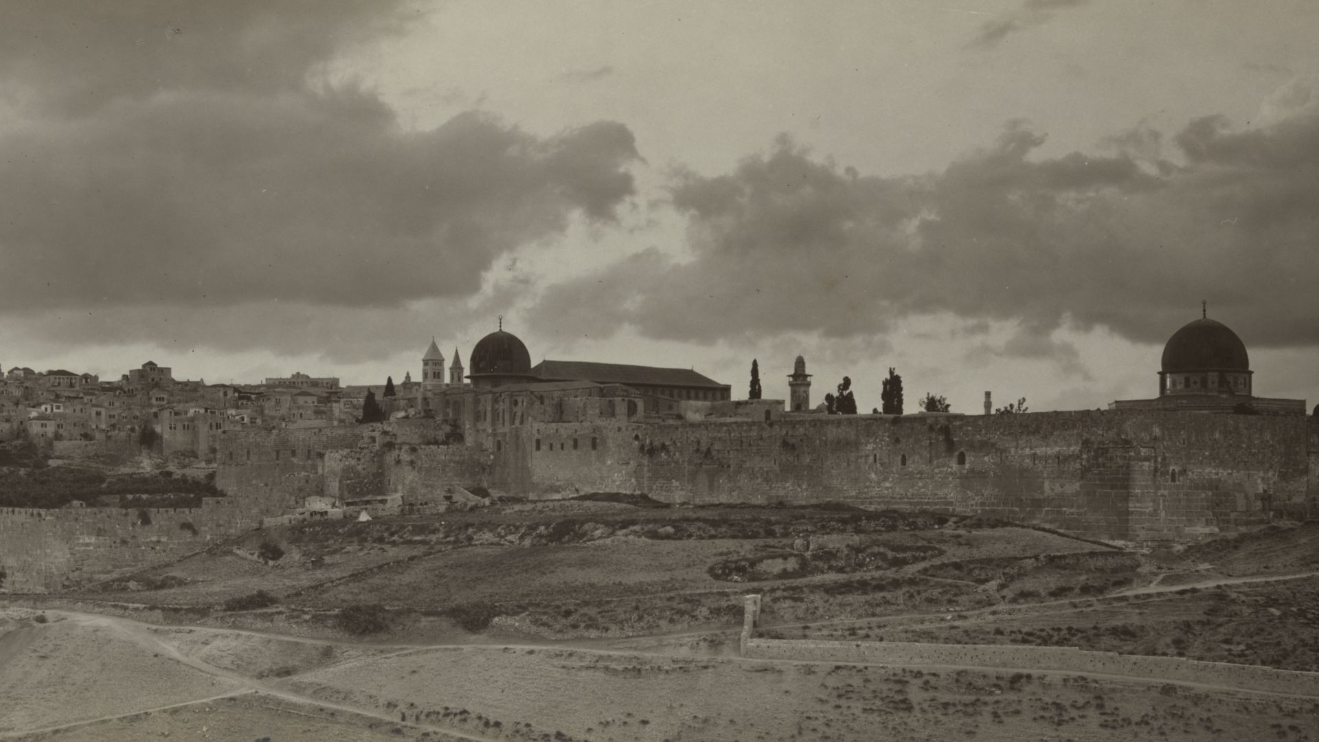 View of Jerusalem from southeast, showing city walls, the Dome of the Rock, and al-Aqsa mosque.