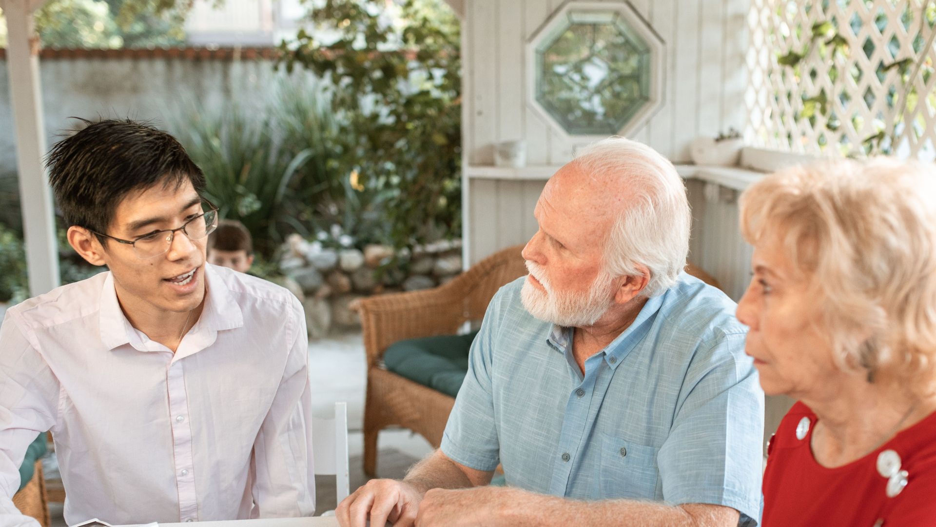 Family sits together discussing ultrasound images, celebrating new life.
