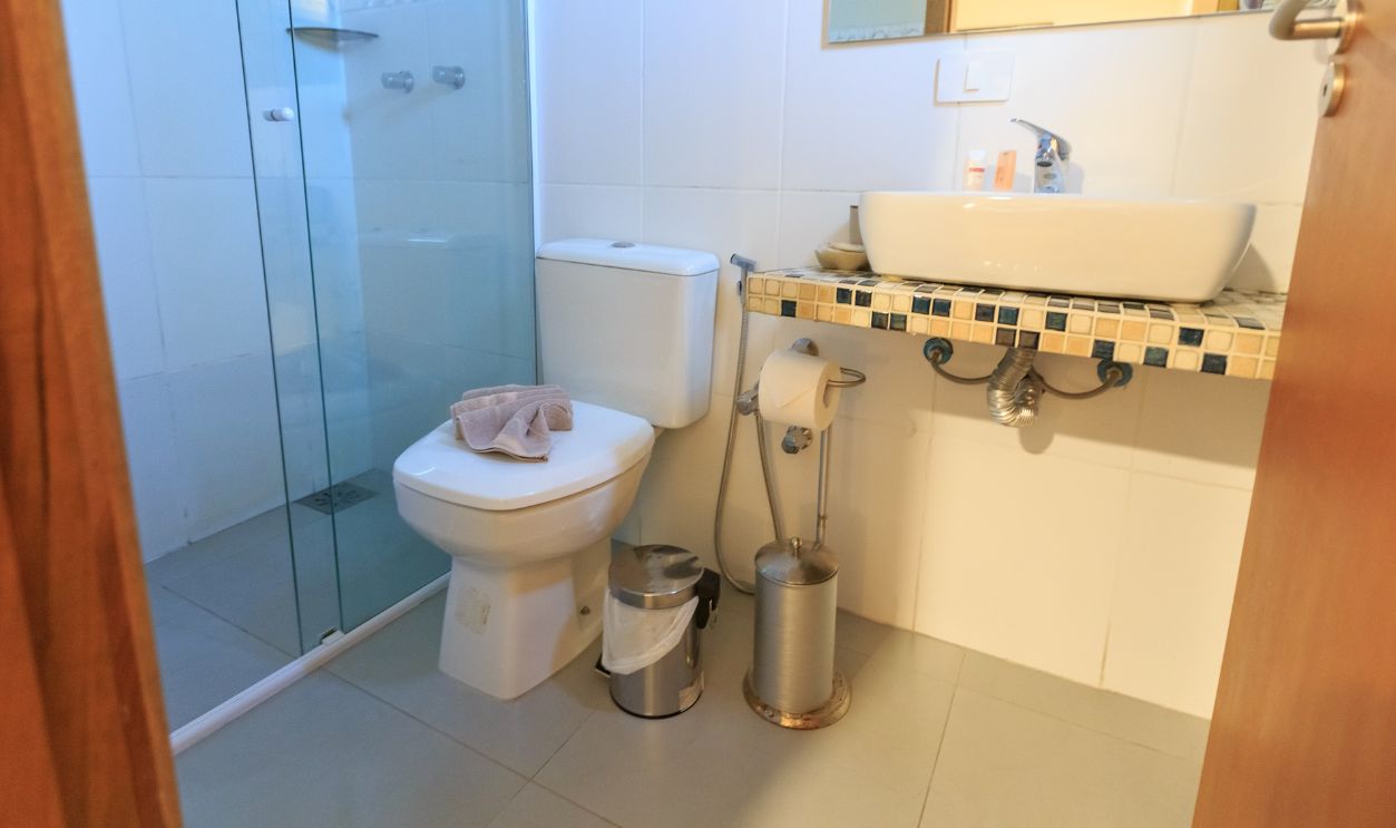 Stylish bathroom featuring a glass shower, contemporary fixtures, and elegant tile work