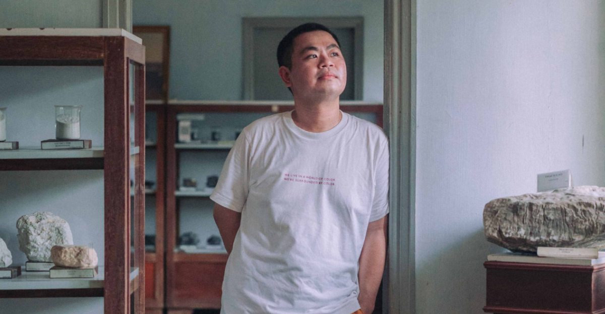 a-man-in-a-t-shirt-and-shorts-standing-in-the-doorway