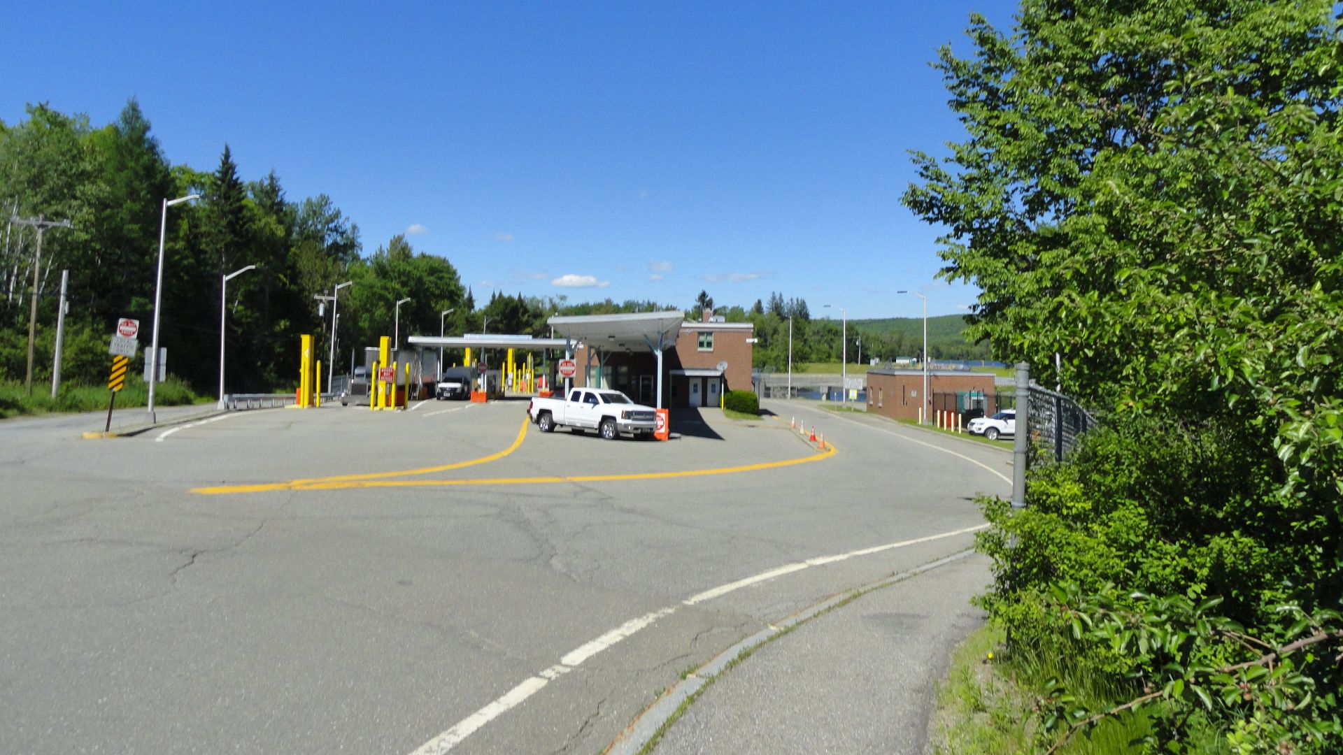 United States border crossing on Maine State Route 6, Vanceboro, Washington County, Maine. Down the hill and to the east is the Canada border crossing on NB Route 4, St. Croix, McAdam Parish, York County, New Brunswick. Both towns are heavily wooded rural