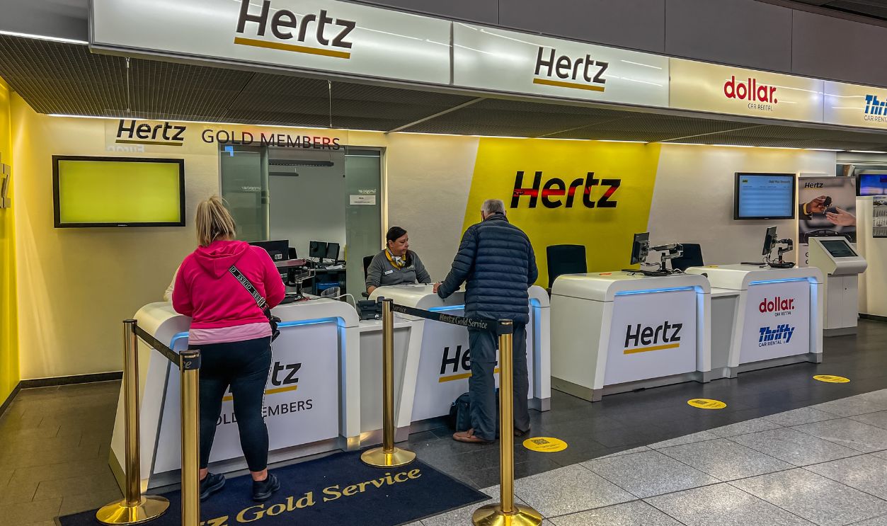 Shutterstock-2561578091, Stuttgart, Germany- October 23, 2024: The Hertz car rental office in stuttgart airport. Hertz is an American car rental company.