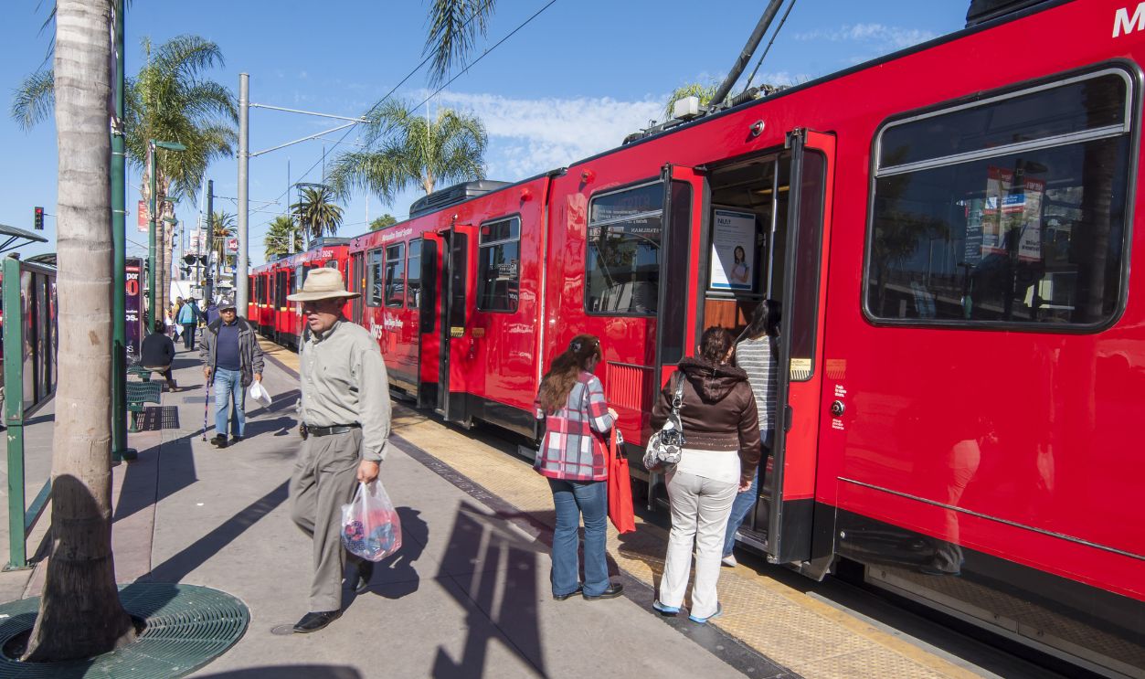 SAN YSIDRO, USA - NOVEMBER 27, 2013: Passengers board the San Diego blue line trolley at the southernmost station stop at the US - Mexico border crossing in San Ysidro on November 27, 2013.