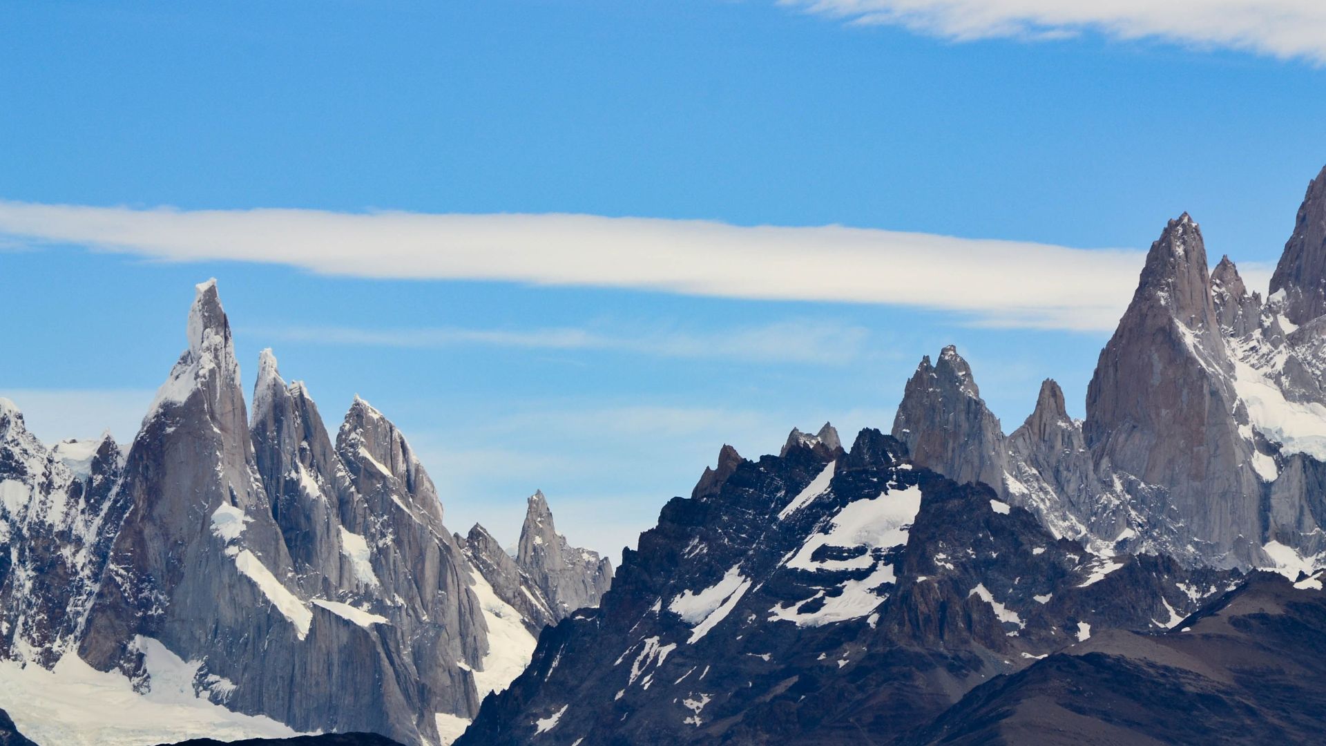 Breathtaking view of Fitz Roy's rugged peaks in Patagonia, Argentina under a clear sky.