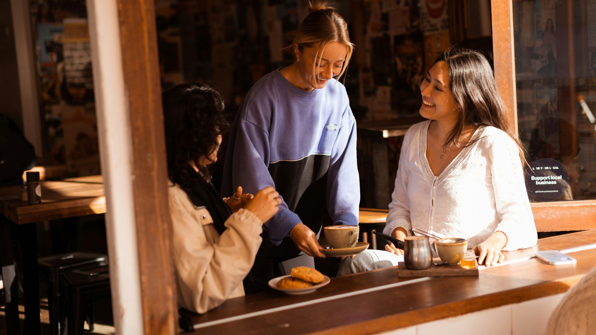 A group of people sitting at a bar