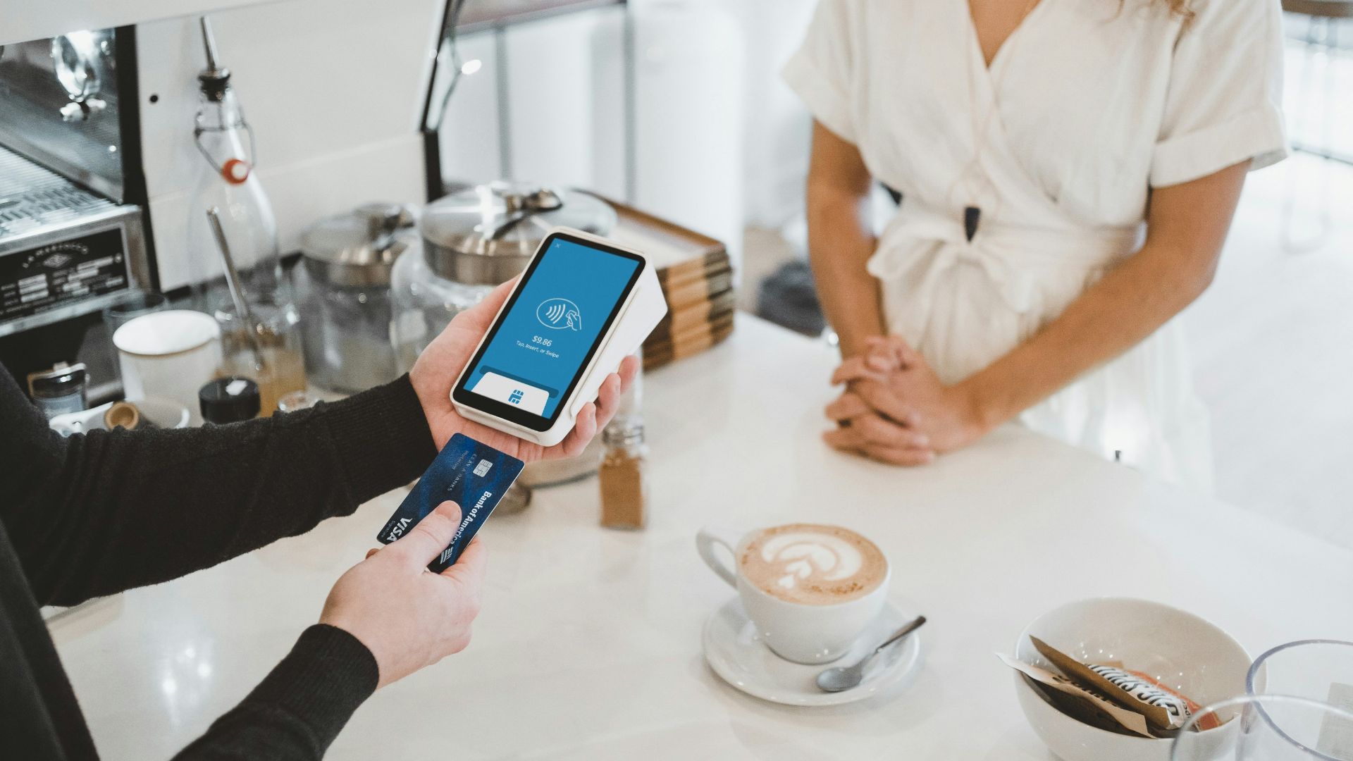 woman standing and holding smartphones