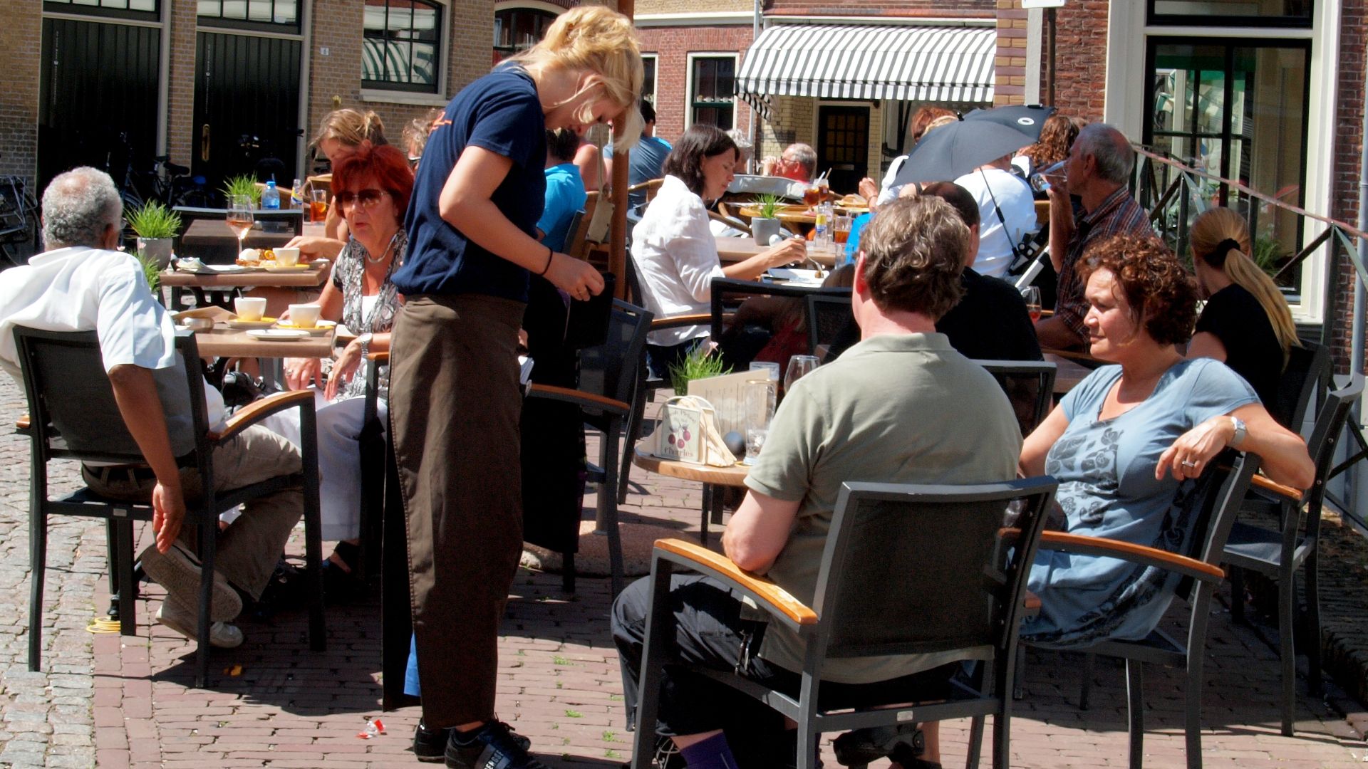 waitress in a café in the centre of oudewater, the netherlands