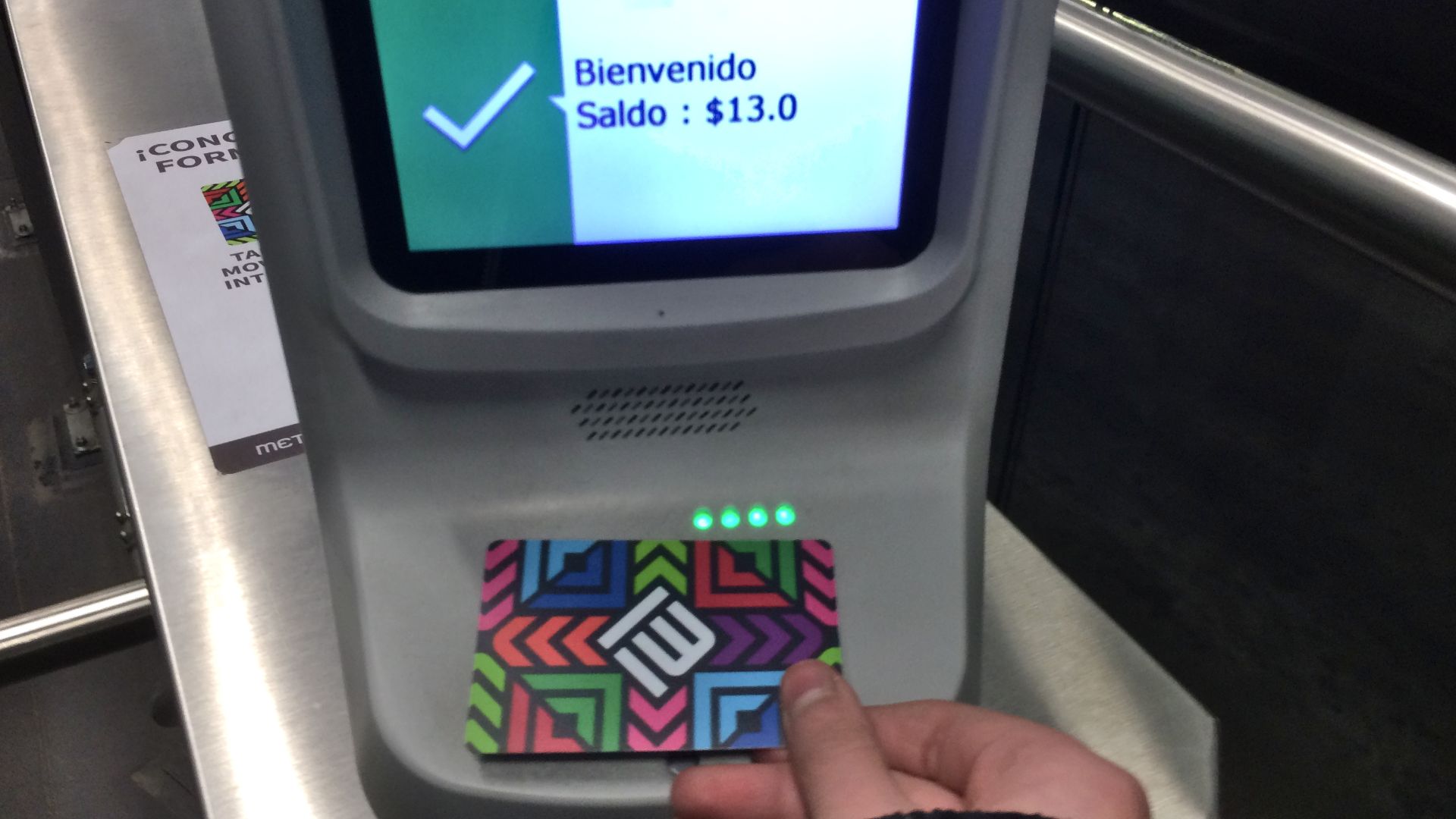 In this picture, a User is shown using the Tarjeta de Movilidad Integrada (Integrated Mobility Card) to access the Metrobus system in Mexico City.