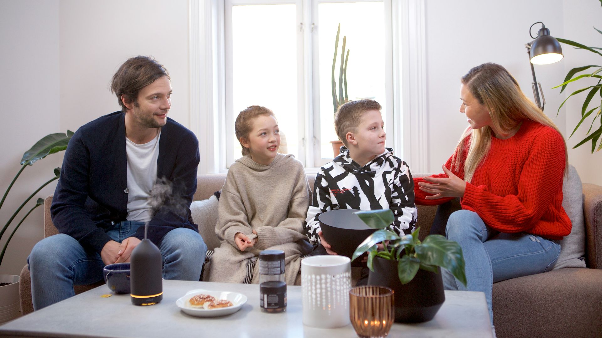 a group of people sitting on top of a couch