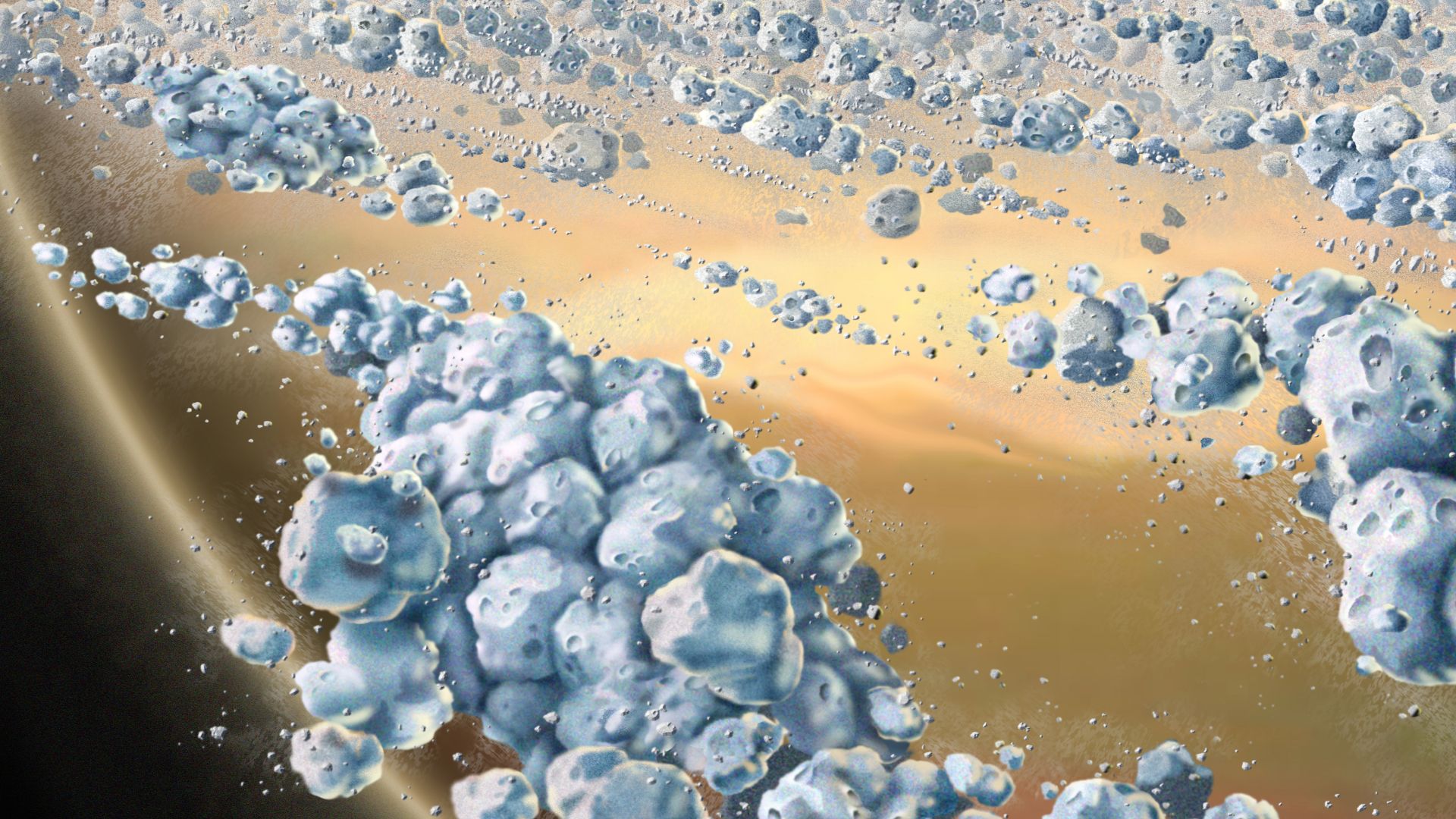 This is an artist concept of a close-up view of Saturn's ring particles. The planet Saturn is seen in the background (yellow and brown). The particles (blue) are composed mostly of ice, but are not uniform. They clump together to form elongated, curved ag