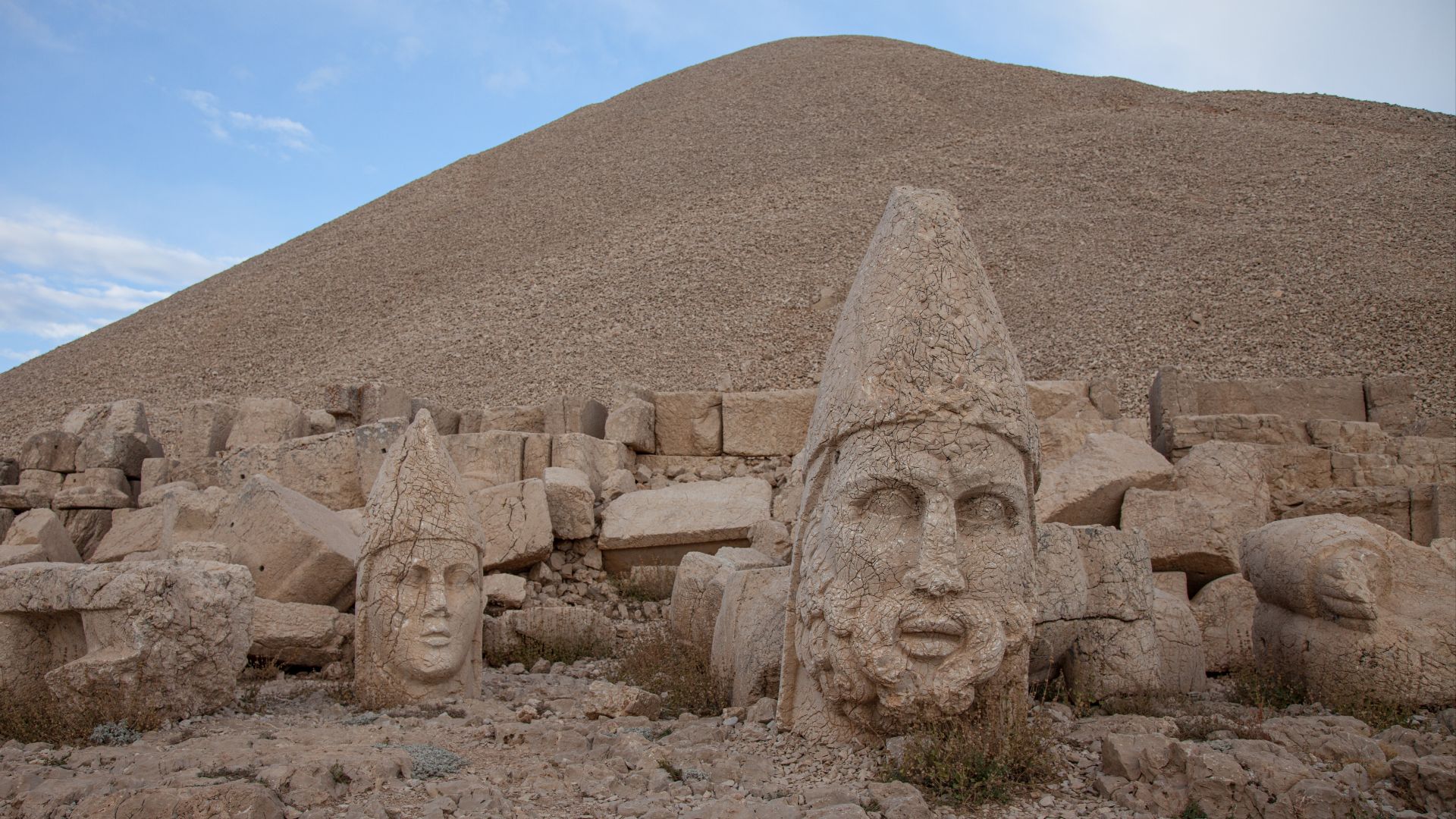 an overall view of the giant head statues on Mount Nemrut