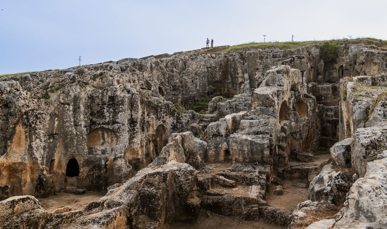 A view of Perrhe ancient city which is one of the five major cities of the Kingdom of Commagene, one of the Hellenistic period kingdoms in Adiyaman, Turkiye on April 28, 2024. The difference of Perrhee from other ancient settlements is that it was built by the architects of the period or the people of the city by shaping the rocks on a hill without bringing any cut block stones from the region. The ongoing archaeological excavations in the ancient city continue to uncover important finds dating from the prehistoric period to the Roman and Byzantine periods