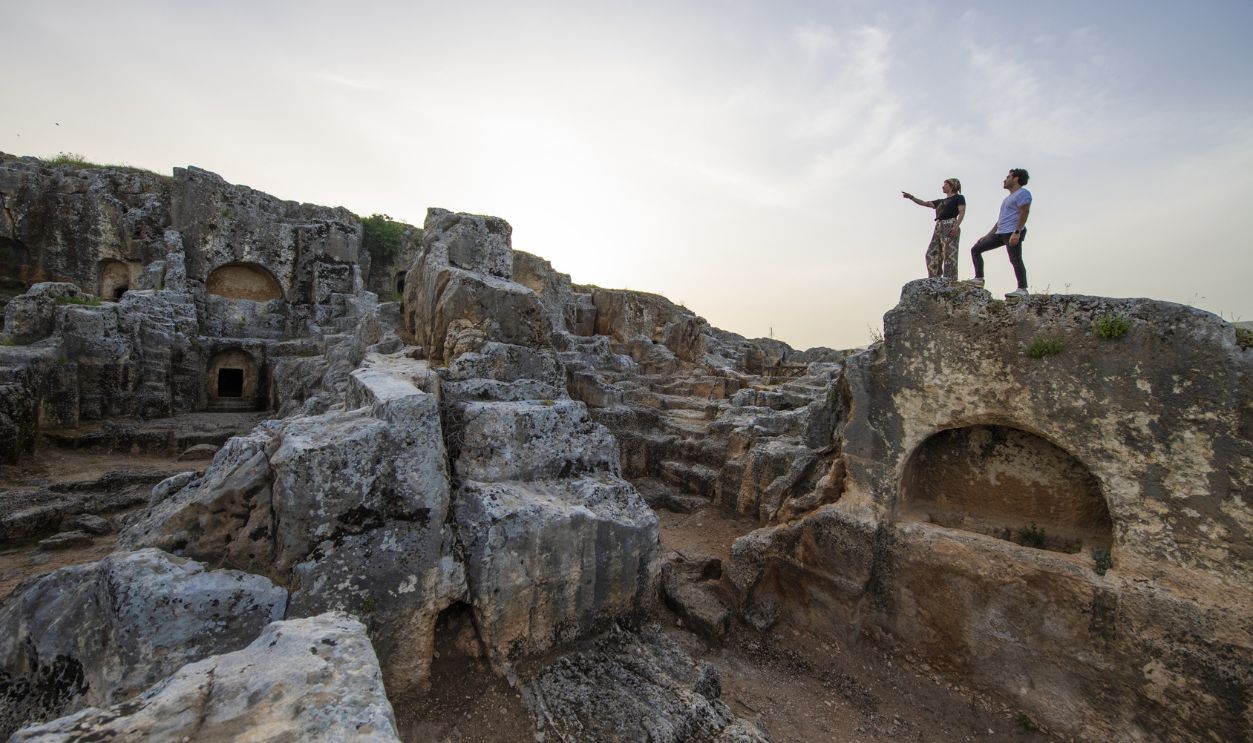 A view of Perrhe ancient city which is one of the five major cities of the Kingdom of Commagene, one of the Hellenistic period kingdoms in Adiyaman, Turkiye on April 28, 2024. The difference of Perrhee from other ancient settlements is that it was built by the architects of the period or the people of the city by shaping the rocks on a hill without bringing any cut block stones from the region. The ongoing archaeological excavations in the ancient city continue to uncover important finds dating from the prehistoric period to the Roman and Byzantine periods
