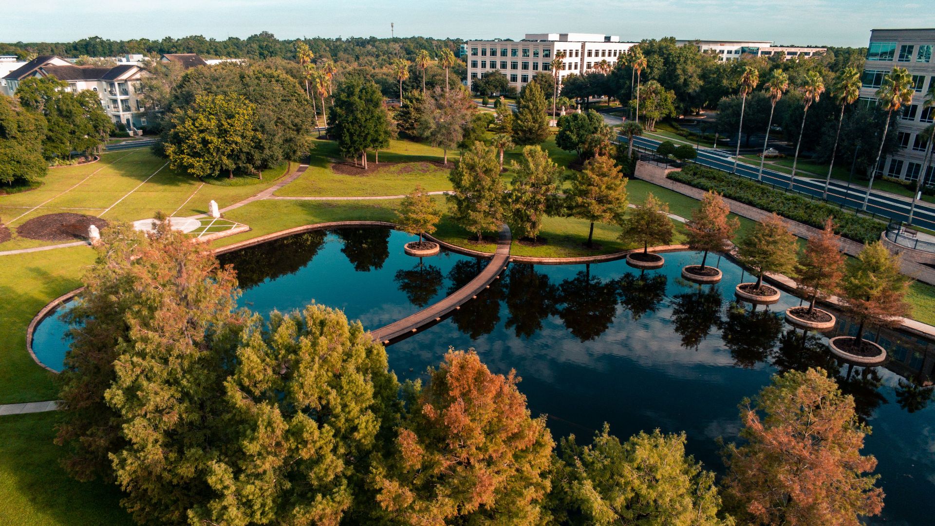 Beautiful aerial view of a park with a pond in Lake Mary, Florida, showcasing autumn foliage.