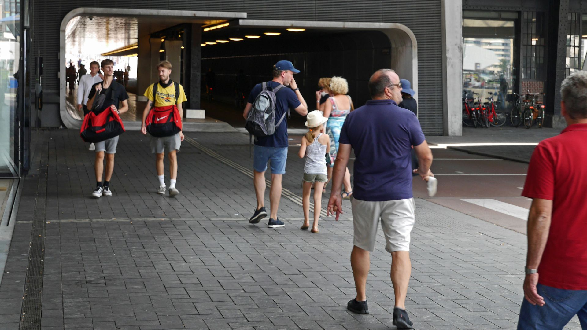 people walking on sidewalk during daytime