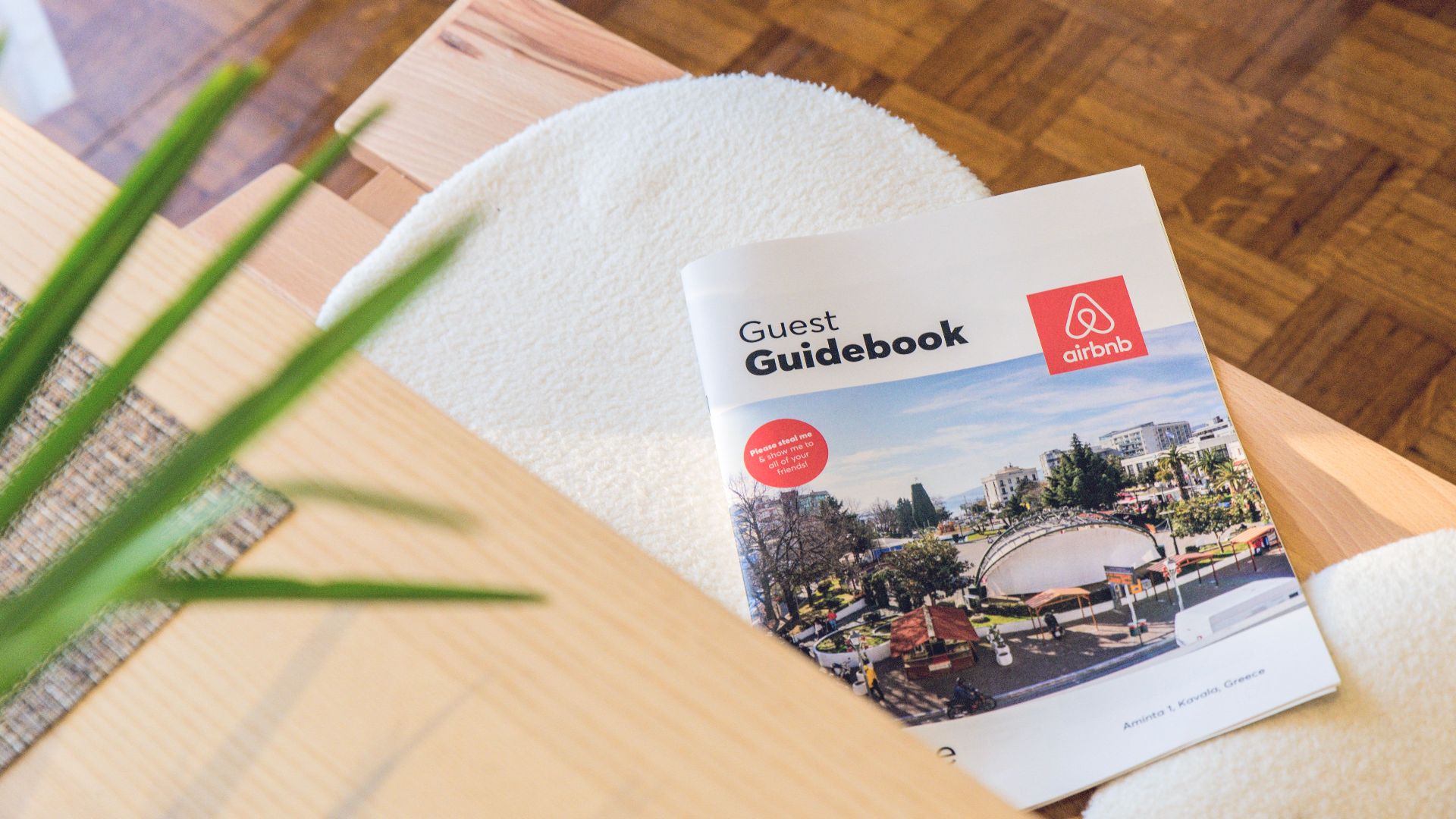 Airbnb Guest Guidebook on a modern table in Kavala, Greece home.