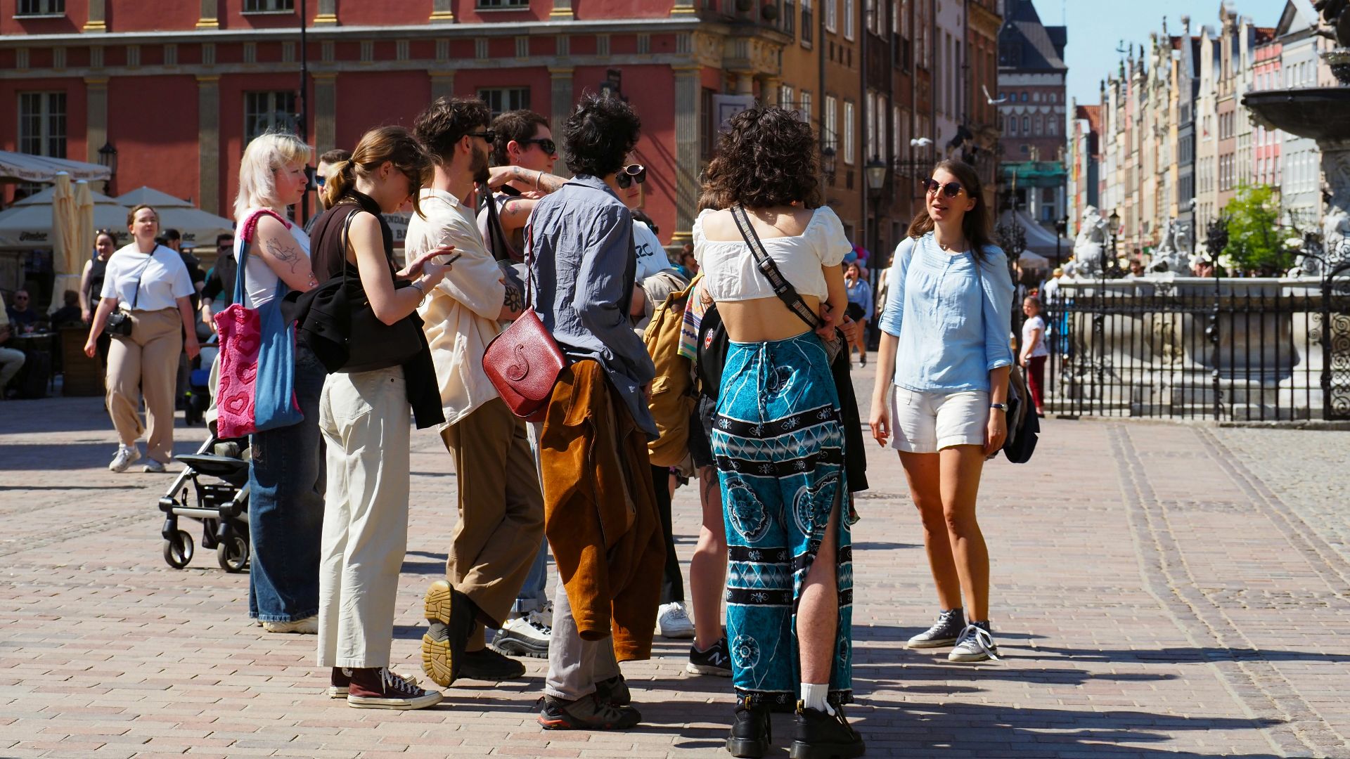 a group of people standing around each other
