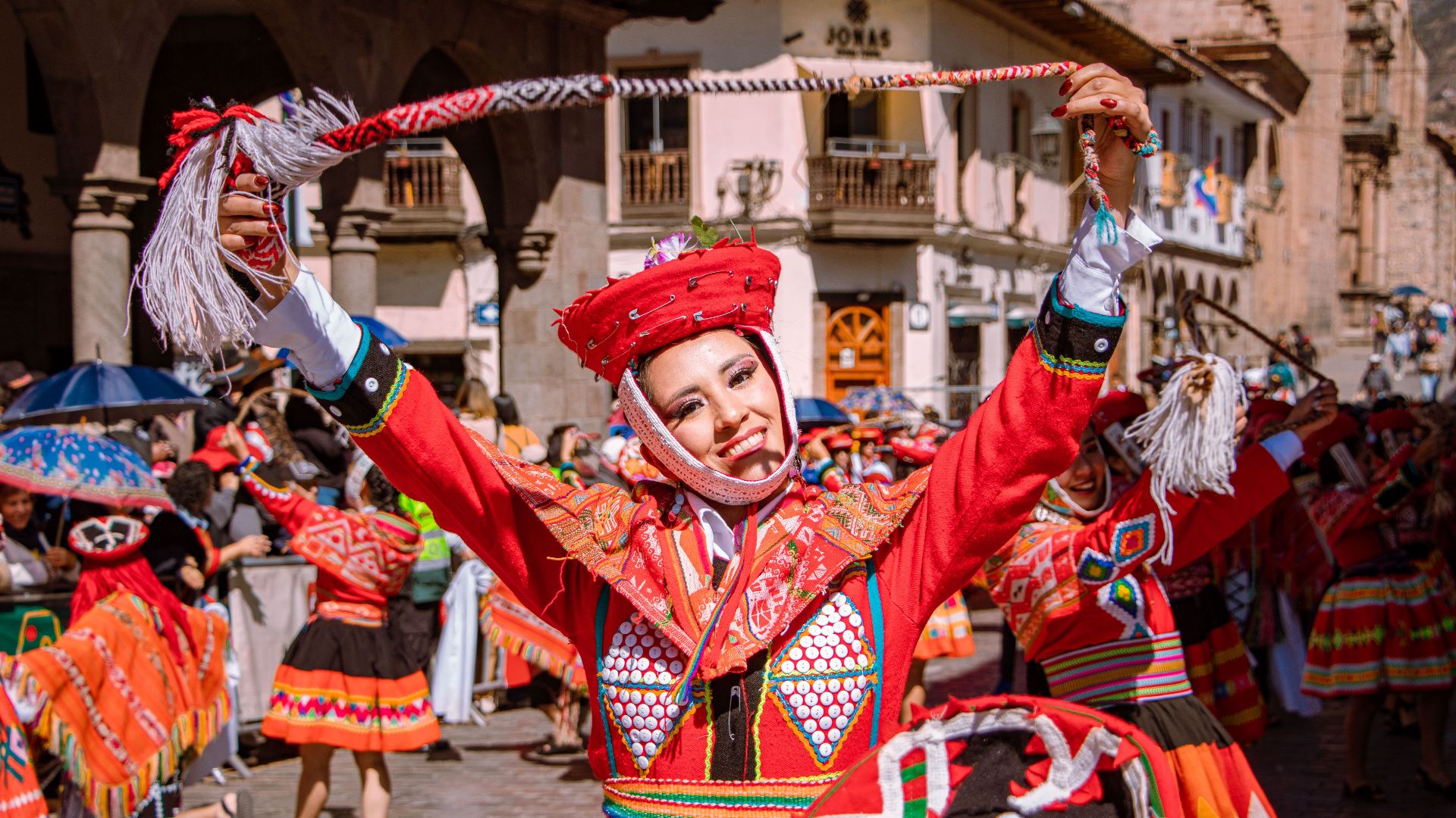 Colorful traditional dance performance during a vibrant cultural festival in Cusco, Peru.