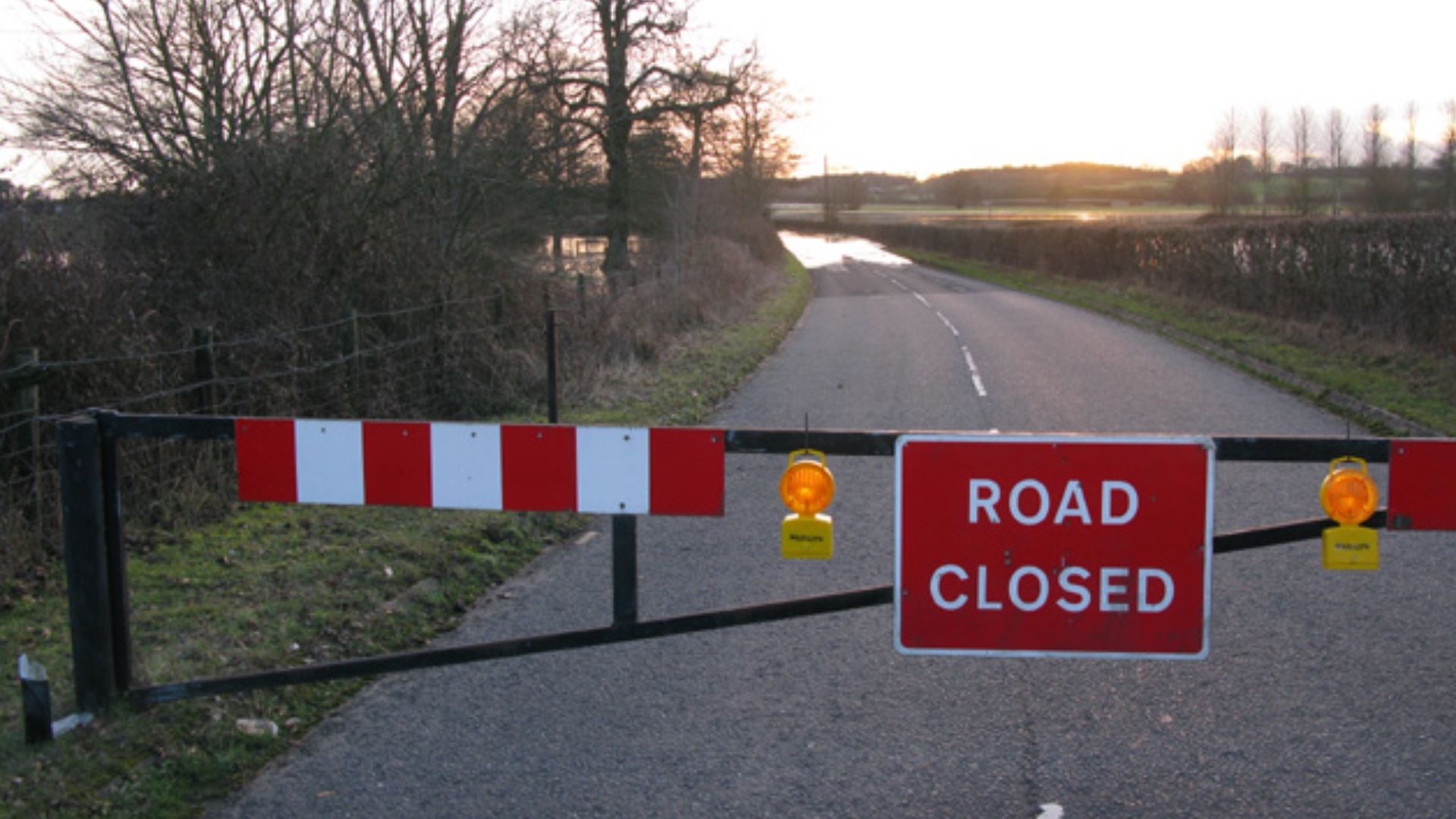 Waterfall Road, closed due to flooding I don't know the area but the fact that there is a proper barrier on the road implies that this isn't the first time it flooded.