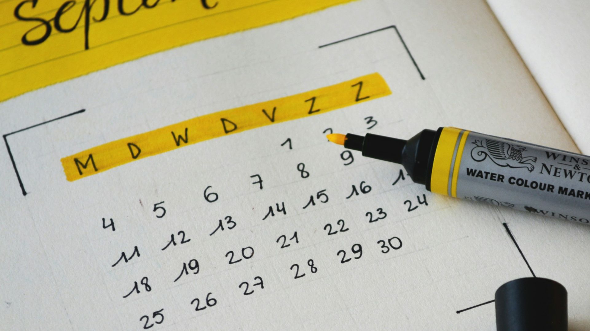 black marker on notebook