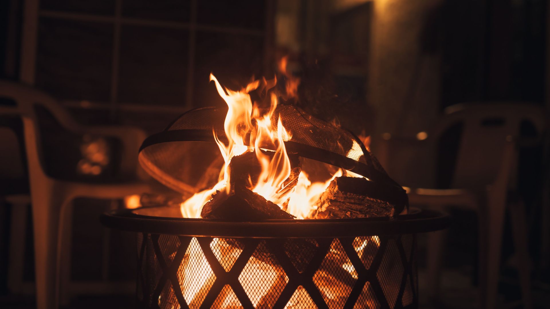 Warm and inviting fire pit with glowing flames, perfect for a cozy evening outdoors.