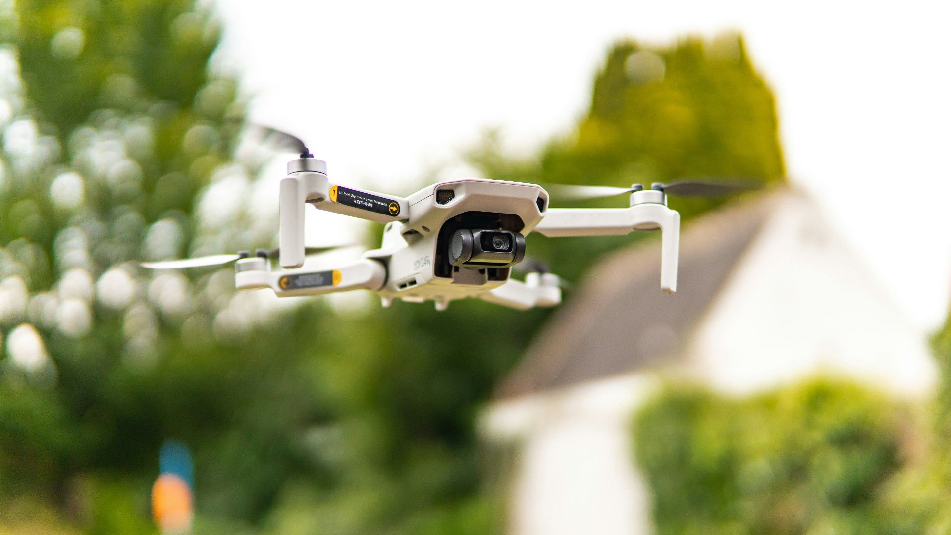 A drone captures aerial views amidst vibrant nature in Brugge, Belgium.