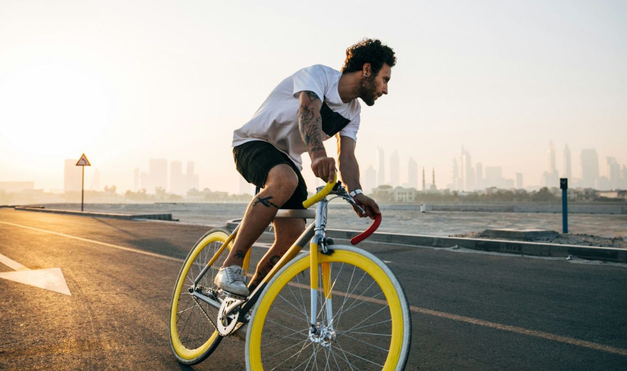 man riding bicycle on road during daytime