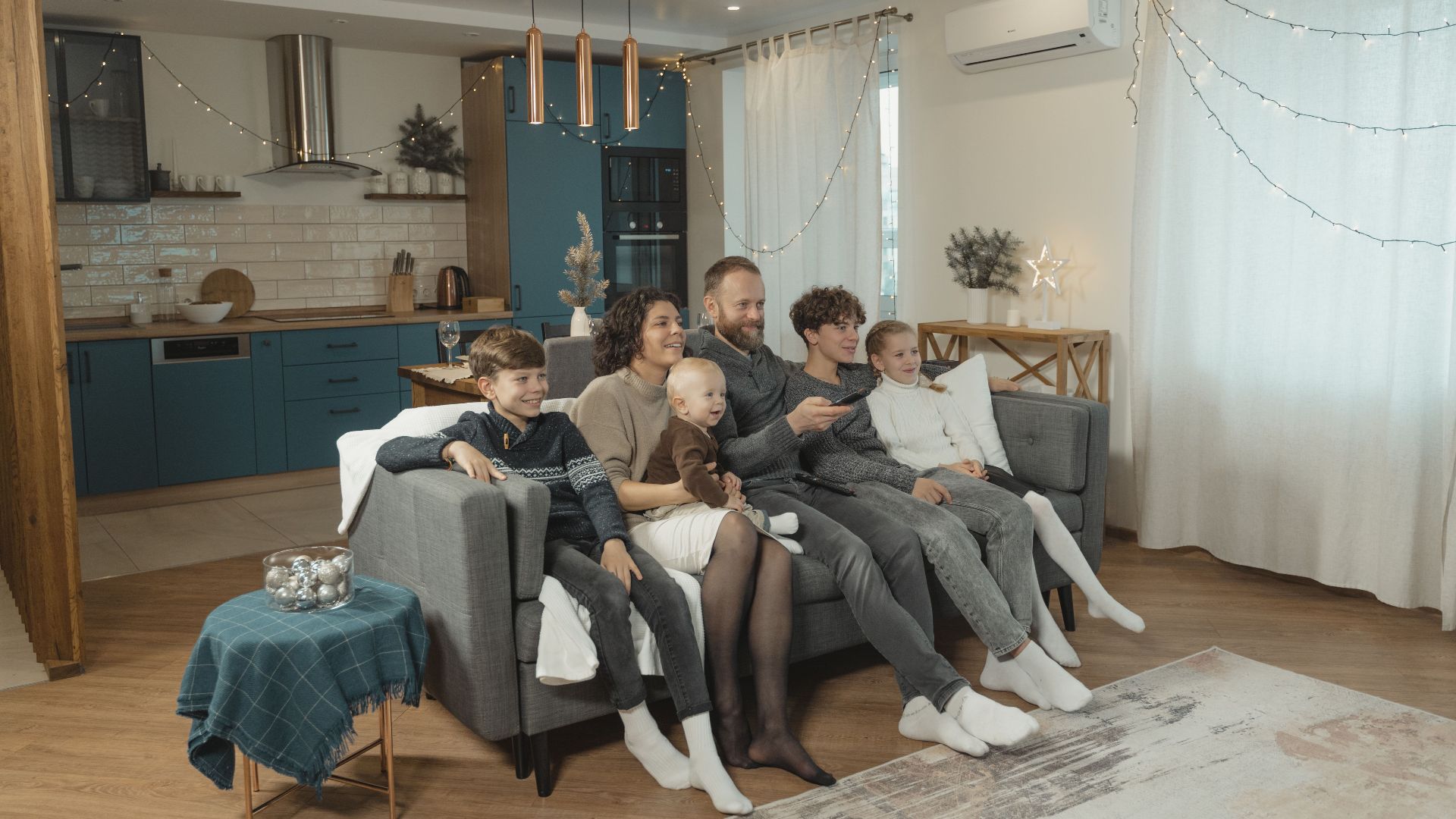 Happy family enjoying quality time together on cozy living room couch.