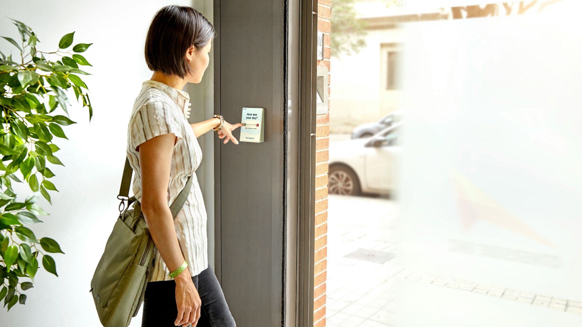 woman in gray t-shirt and blue denim jeans sitting on white wooden framed glass door