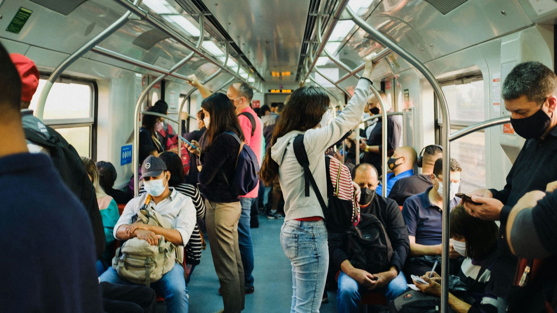 people in train during daytime