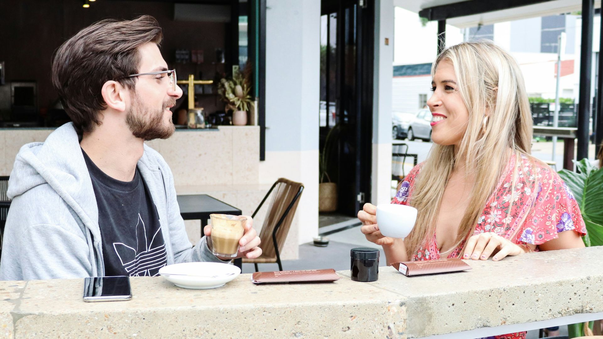 man and woman sitting on chair in restaurant